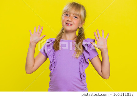 Young cute school girl kid smiling friendly gesturing hello or goodbye, welcoming, waving hands 105111832