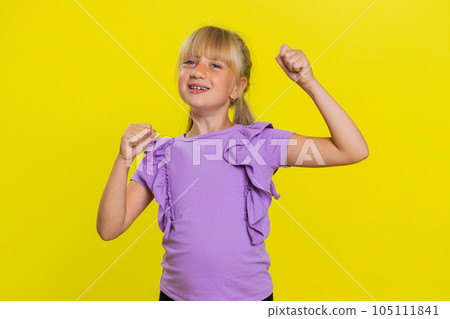Young preteen child girl kid celebrating success, winning, birthday, lottery jackpot goal achievemen 105111841