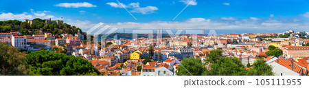 Lisbon famous panorama from Miradouro dos Barros tourist viewpoint over Alfama old district with St. George's Castle, Portugal flag, 25th of April Bridge, Christ the King statue. Lisbon, Portugal. 105111955