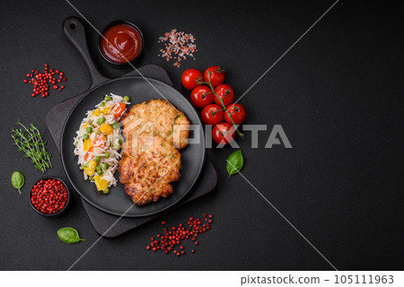 Delicious fresh fried minced chicken meat cutlets with salt, spices and herbs 105111963