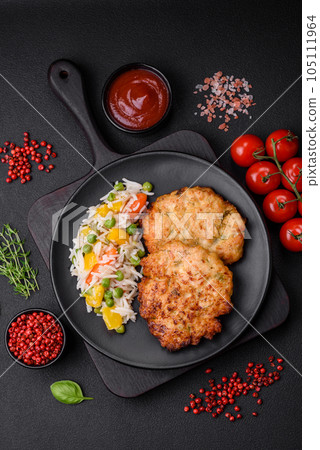 Delicious fresh fried minced chicken meat cutlets with salt, spices and herbs 105111964