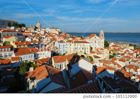 View of Lisbon famous postcard iconic view from Miradouro de Santa Luzia tourist viewpoint over Alfama old city district. Lisbon, Portugal. 105112000