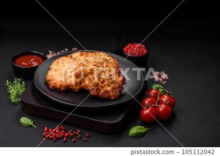 Delicious fresh fried minced chicken meat cutlets with salt, spices and herbs 105112042