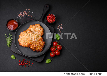Delicious fresh fried minced chicken meat cutlets with salt, spices and herbs Delicious fresh fried minced chicken meat cutlets with salt, spices and herbs 105112043