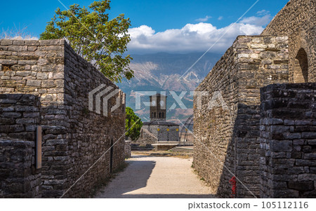 Clock Tower in Gjirokaster Citadel surrounded by ancient ruins, attraction in Albania, Europe 105112116