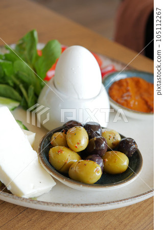 cheese tomato and olive on a plate cheese tomato and olive on a plate 105112267