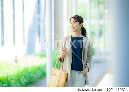 Office casual woman walking outdoors Office casual woman walking outdoors 105113081