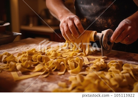 hand-cutting pasta dough into tagliatelle, created with generative ai hand-cutting pasta dough into tagliatelle, created with generative ai 105113922