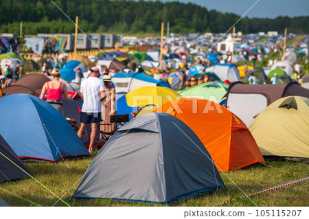 Travelers and camping tents on meadow in countryside Travelers and camping tents on meadow in countryside 105115207