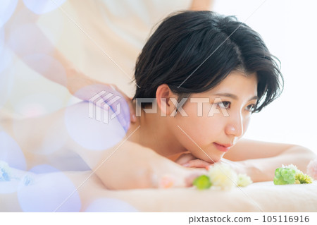 A young woman having an esthetic treatment at an esthetic salon A young woman having an esthetic treatment at an esthetic salon 105116916
