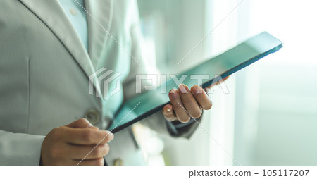 Business woman with tablet Business woman with tablet 105117207