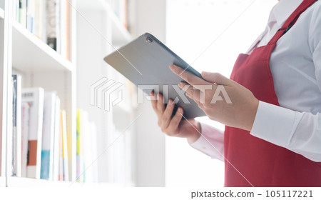 woman working in a bookstore woman working in a bookstore 105117221