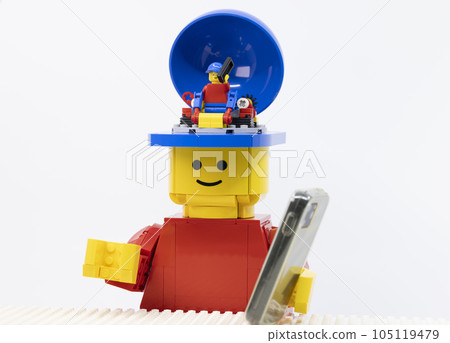 giant man use the phone, at the same time the mini one also using the phone as like as him giant man use the phone, at the same time the mini one also using the phone as like as him 105119479