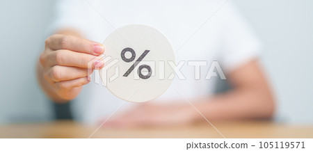 Woman show percentage symbol paper. Interest rate, financial, ranking, discount and promotion and mortgage rates concept Woman show percentage symbol paper. Interest rate, financial, ranking, discount and promotion and mortgage rates concept 105119571