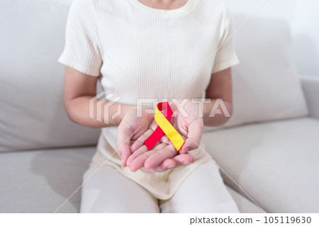 woman holding Red and Yellow ribbon. World hepatitis day awareness month, 28 July, Liver cancer, Jaundice, Cirrhosis, Failure, Enlarged, Hepatic Encephalopathy and Health concept woman holding Red and Yellow ribbon. World hepatitis day awareness month, 28 July, Liver cancer, Jaundice, Cirrhosis, Failure, Enlarged, Hepatic Encephalopathy and Health concept 105119630