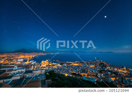 Naples, Italy. Skyline Cityscape In Evening Lighting. Tyrrhenian Sea And Landscape With Volcano Mount Vesuvius. City In Night Illuminations 105121094