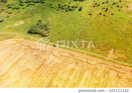 Aerial View Of Car SUV Parked Near Countryside Road In Summer Field Rural Landscape. Yellow Wheat Field In Summer Season 105121102