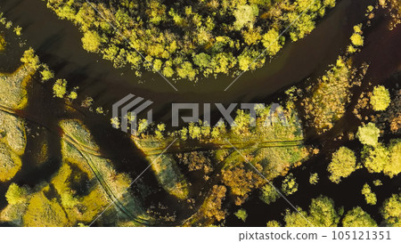 Fast take off Flat View Aerial View Green Forest Woods And Curved River Landscape In Sunny Spring Day. Top View Of Rivers Nature From Attitude In Spring Season. Drone Flight View. Fast take off Flat View Aerial View Green Forest Woods And Curved River Landscape In Sunny Spring Day. Top View Of Rivers Nature From Attitude In Spring Season. Drone Flight View. 105121351