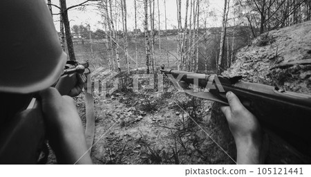 Re-enactors Dressed As Soviet Russian Soldier Aiming With Rifles. Soldiers Shoots With Rifle. Soviet Russian Soldier Uniform. Black And White Re-enactors Dressed As Soviet Russian Soldier Aiming With Rifles. Soldiers Shoots With Rifle. Soviet Russian Soldier Uniform. Black And White 105121441