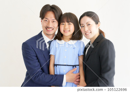 Little girl and her parents in suits 105122696