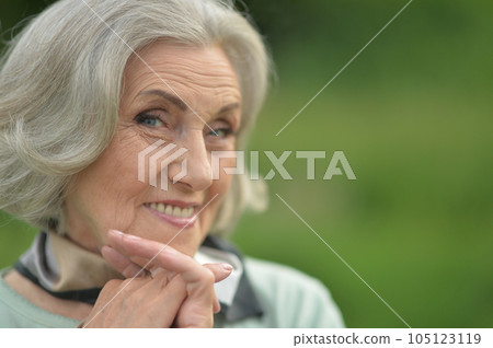 A beautiful elderly walks near their house A beautiful elderly walks near their house 105123119