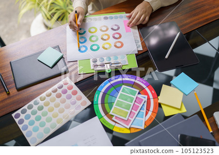 Creative idea Business female Artist Creative Designer sketch graphic drawing on graphic tablet and Color swatch samples Concept of idea creativity. Creative idea Business female Artist Creative Designer sketch graphic drawing on graphic tablet and Color swatch samples Concept of idea creativity. 105123523