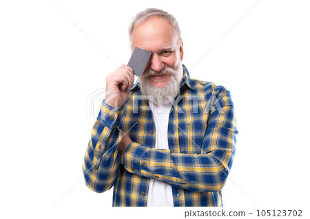 handsome 60s middle aged gray-haired man with a beard holding a plastic card on a white background handsome 60s middle aged gray-haired man with a beard holding a plastic card on a white background 105123702
