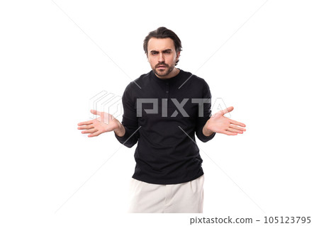 young brunette caucasian male model with beard dressed casual shrugs shoulders in ignorance young brunette caucasian male model with beard dressed casual shrugs shoulders in ignorance 105123795