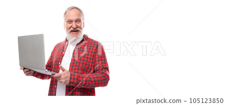 smart 60s middle aged mature man in a stylish shirt masters a laptop smart 60s middle aged mature man in a stylish shirt masters a laptop 105123850