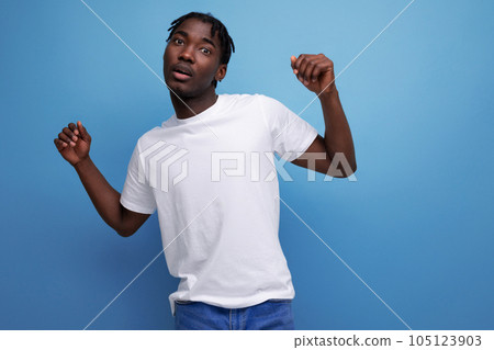 American young man with dreadlocks is wearing a white T-shirt for printing information on it American young man with dreadlocks is wearing a white T-shirt for printing information on it 105123903