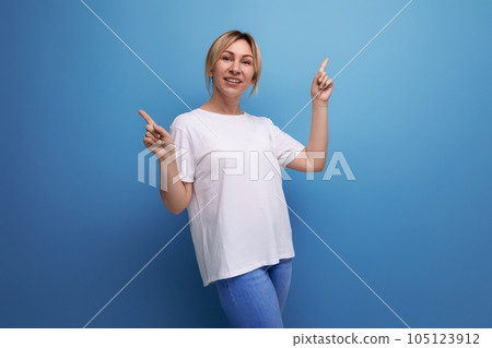 blond thin woman is dressed in a white T-shirt for printing information on it blond thin woman is dressed in a white T-shirt for printing information on it 105123912