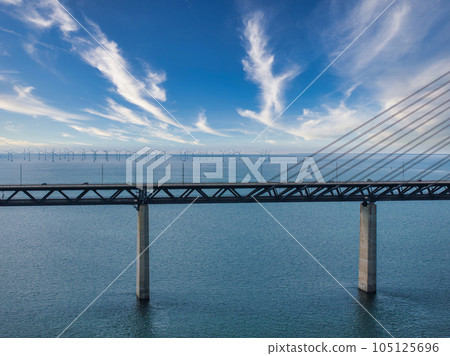 Panoramic aerial close up view of Oresund bridge over the Baltic sea between Malmo city in Sweden and Copenhagen in Denmark. 105125696