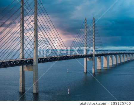 Panoramic aerial close up view of Oresund bridge over the Baltic sea between Malmo city in Sweden and Copenhagen in Denmark. 105125700