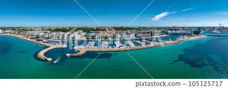 View of the Helsinborg city centre and the port of Helsingborg in Sweden. Old town by the beach and city port in Helsingborg harbour. Beautiful aerial view. View of the Helsinborg city centre and the port of Helsingborg in Sweden. Old town by the beach and city port in Helsingborg harbour. Beautiful aerial view. 105125717