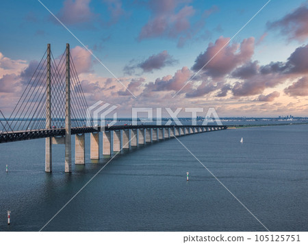 Panoramic aerial close up view of Oresund bridge over the Baltic sea between Malmo city in Sweden and Copenhagen in Denmark. Panoramic aerial close up view of Oresund bridge over the Baltic sea between Malmo city in Sweden and Copenhagen in Denmark. 105125751