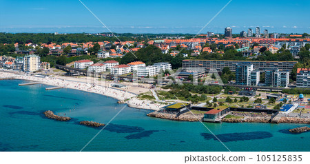 View of the Helsinborg city centre and the port of Helsingborg in Sweden. Old town by the beach and city port in Helsingborg harbour. Beautiful aerial view. View of the Helsinborg city centre and the port of Helsingborg in Sweden. Old town by the beach and city port in Helsingborg harbour. Beautiful aerial view. 105125835