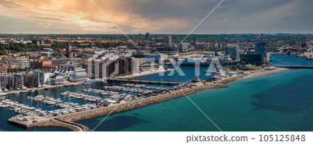 View of the Helsinborg city centre and the port of Helsingborg in Sweden. Old town by the beach and city port in Helsingborg harbour. Beautiful aerial view. View of the Helsinborg city centre and the port of Helsingborg in Sweden. Old town by the beach and city port in Helsingborg harbour. Beautiful aerial view. 105125848