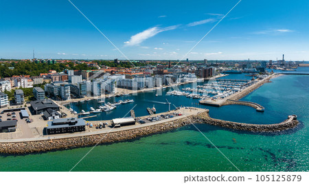 View of the Helsinborg city centre and the port of Helsingborg in Sweden. Old town by the beach and city port in Helsingborg harbour. Beautiful aerial view. View of the Helsinborg city centre and the port of Helsingborg in Sweden. Old town by the beach and city port in Helsingborg harbour. Beautiful aerial view. 105125879