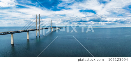 Panoramic aerial close up view of Oresund bridge over the Baltic sea between Malmo city in Sweden and Copenhagen in Denmark. Panoramic aerial close up view of Oresund bridge over the Baltic sea between Malmo city in Sweden and Copenhagen in Denmark. 105125994