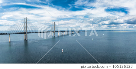 Panoramic aerial close up view of Oresund bridge over the Baltic sea between Malmo city in Sweden and Copenhagen in Denmark. 105126123