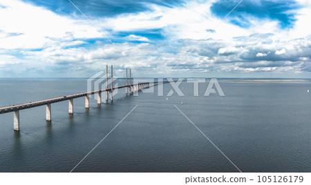 Panoramic aerial close up view of Oresund bridge over the Baltic sea between Malmo city in Sweden and Copenhagen in Denmark. Panoramic aerial close up view of Oresund bridge over the Baltic sea between Malmo city in Sweden and Copenhagen in Denmark. 105126179