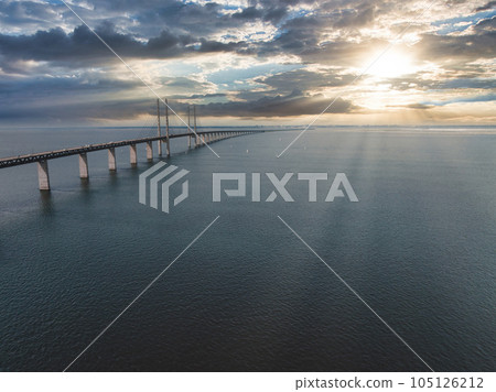 Panoramic aerial close up view of Oresund bridge over the Baltic sea between Malmo city in Sweden and Copenhagen in Denmark. 105126212
