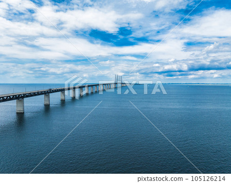 Panoramic aerial close up view of Oresund bridge over the Baltic sea between Malmo city in Sweden and Copenhagen in Denmark. 105126214