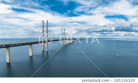 Panoramic aerial close up view of Oresund bridge over the Baltic sea between Malmo city in Sweden and Copenhagen in Denmark. 105126320