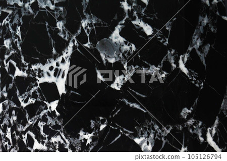 Black marble with white ornament. Black and white marble as the background. Natural pattern of black marble. Abstract marble as a design background. Black marble with white ornament. Black and white marble as the background. Natural pattern of black marble. Abstract marble as a design background. 105126794