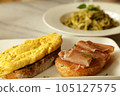 Breakfast set. Delicious sandwich - omelette and smoked ham with honey  on toasted bread. 105127575