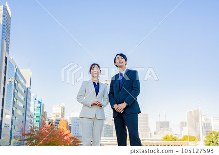 Business woman male blue sky 105127593
