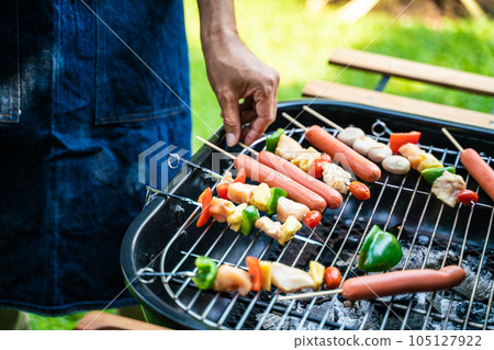People hand grill BBQ in food party home garden People hand grill BBQ in food party home garden 105127922