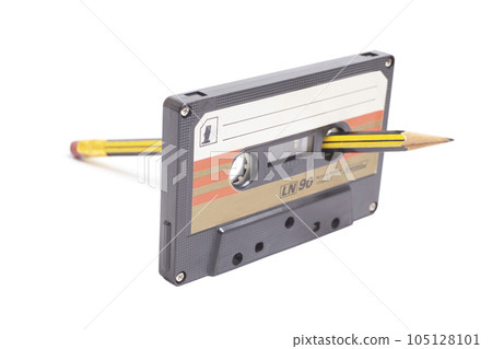 Audio cassette tape with pencil side 1 isolated on white background, vintage 80's music concept 105128101