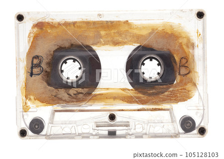 Close up of old audio tape cassette side B, isolated on white background, vintage 80's music concept. Close up of old audio tape cassette side B, isolated on white background, vintage 80's music concept. 105128103